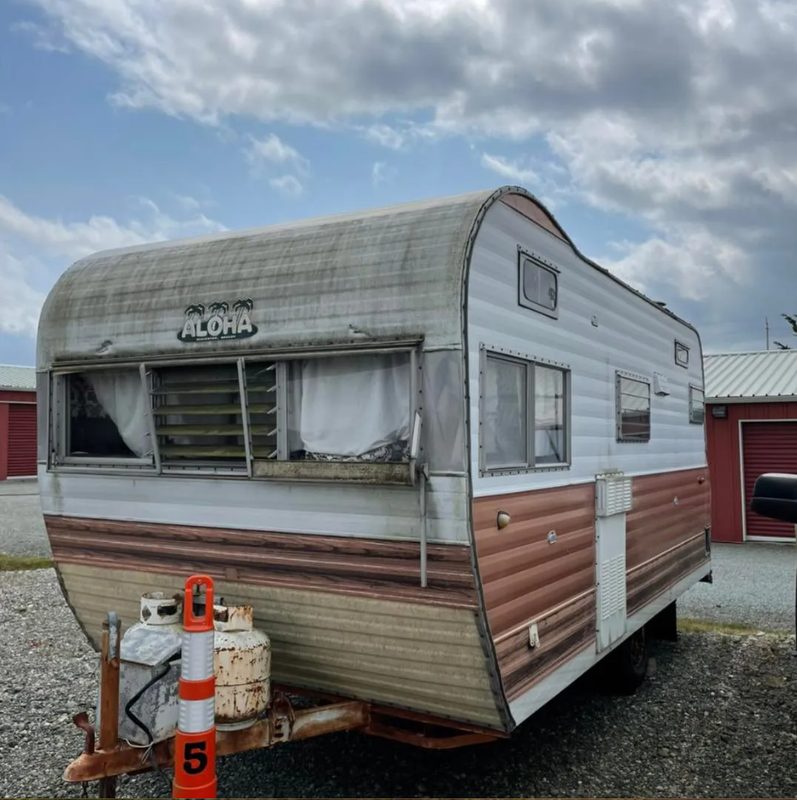 Old camper trailer ready for demolition and removal